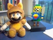 Stuffed Mario tanuki and Link of Lego.