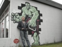 Life size Hulk on the side of a Comic store.