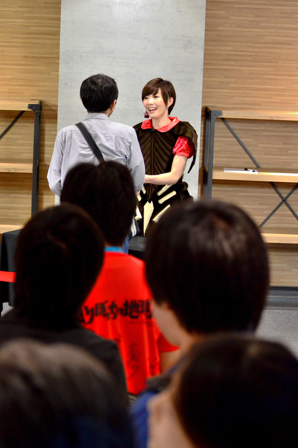 A line quickly formed due to her popularity. At the autograph session, some fans bought more than one product so that they could shake her hand multiple times. 15