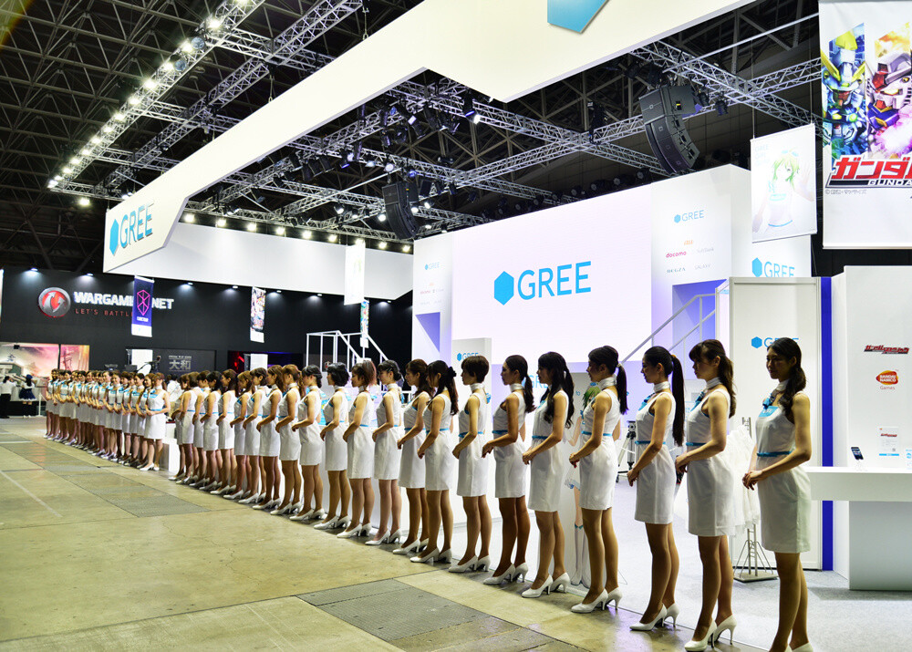 The GREE booth during the customary booth girl greeting. Booth girls were at the event on every day from its opening to closing. 5