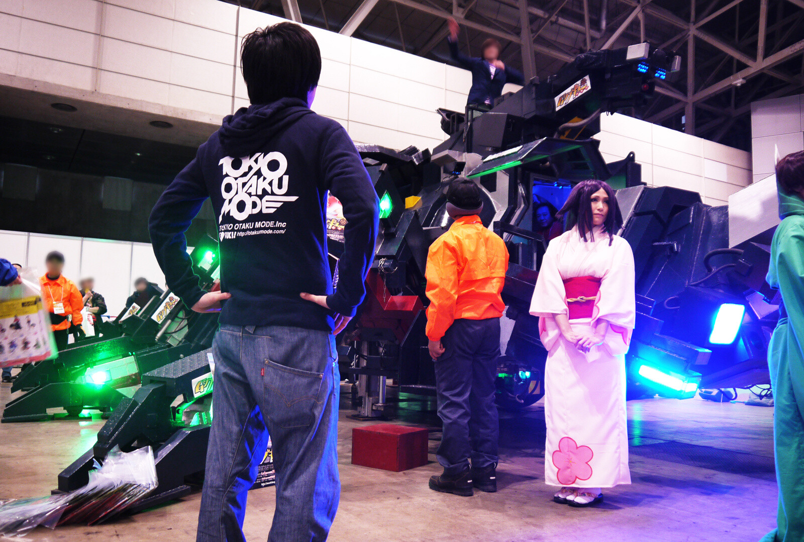 A TOM journalist looks on enviously at those riding atop the robot. 3