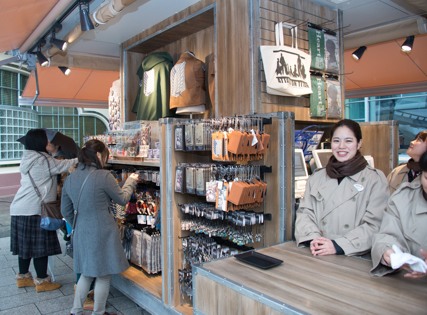A kiosk selling *Attack on Titan* merchandise 23