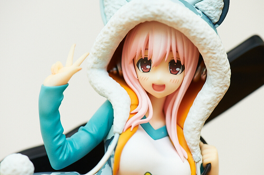 Though hidden by the hood, she of course also has her headphones. 34