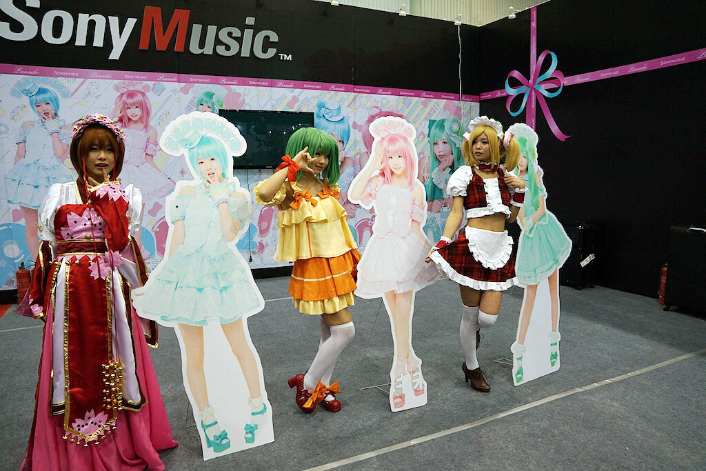 Posing with their life-size cutouts. Cheese! 3