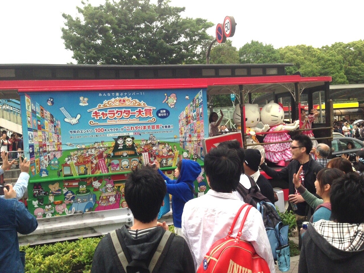 Hello Kitty gives a speech to passersby on the streets of Japan.  0