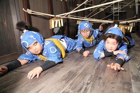 The three ninjas experience the “Ninja Training Dojo” attraction.  2