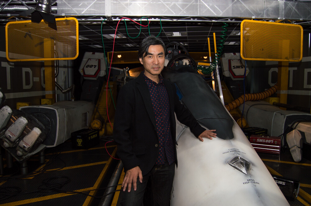Shoji Kawamori, chief animation director on *Macross F*, supervised the project as a mechanical designer. 13
