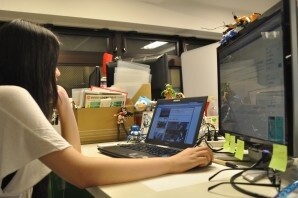 Sattomii's desk, with lots of figures. 3