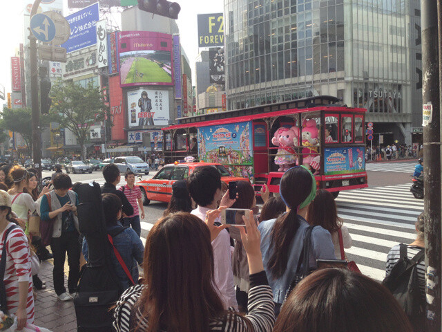 Hello Kitty gives a speech to passersby on the streets of Japan.  2