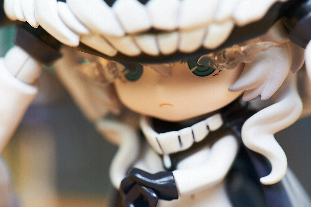 Her puzzling face is the same even as a Nendoroid. 54