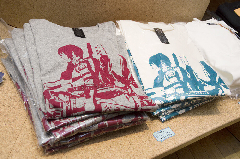 A T-shirt with a collage of Nagate Tanikaze and Tsugumori. It comes in gray and natural. 14