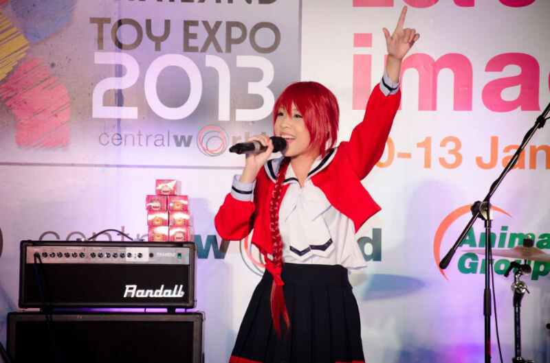 Singing enthusiastically at an event 2
