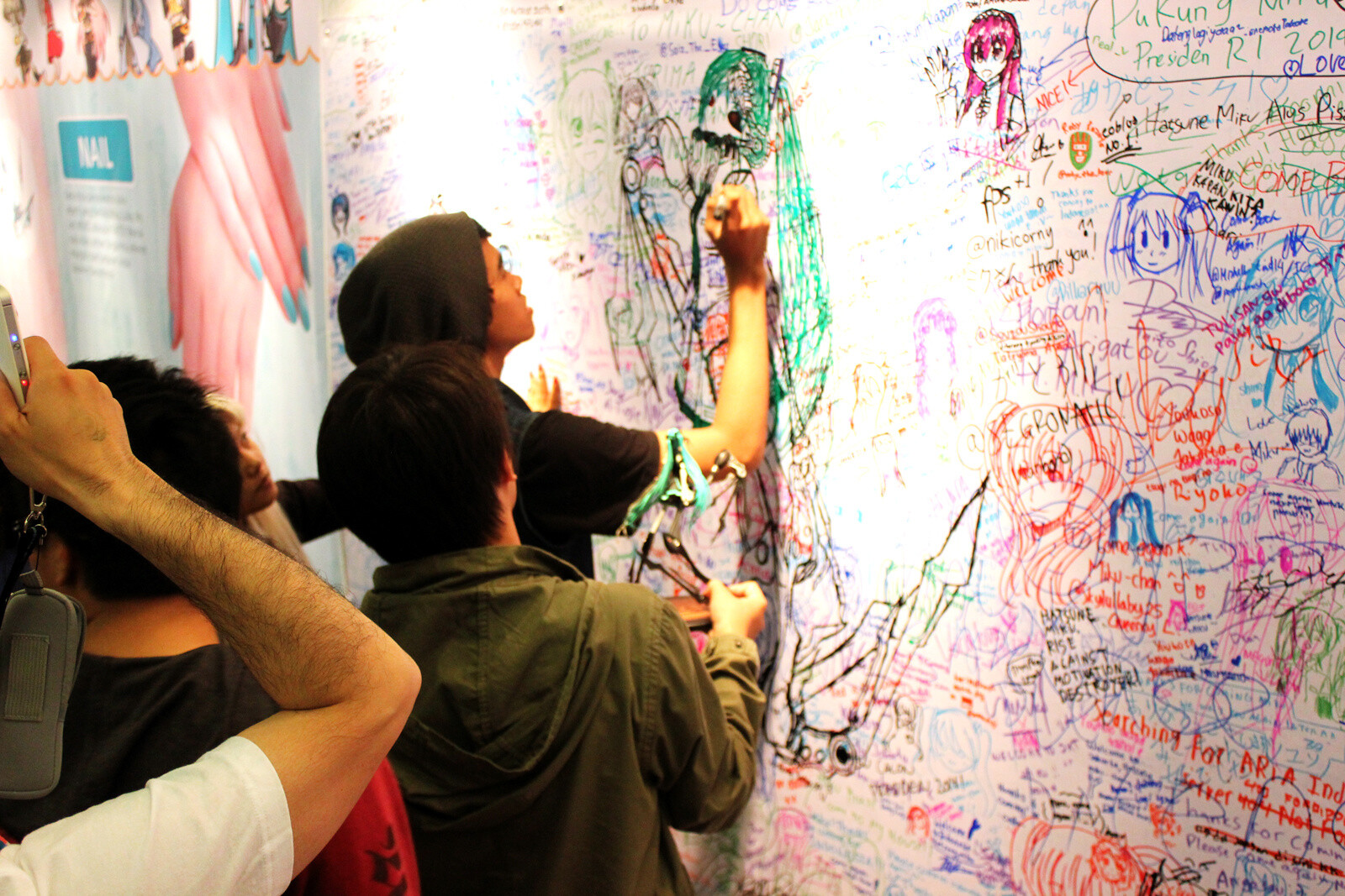 Visitors wrote messages and drew illustrations on this writing wall. 24