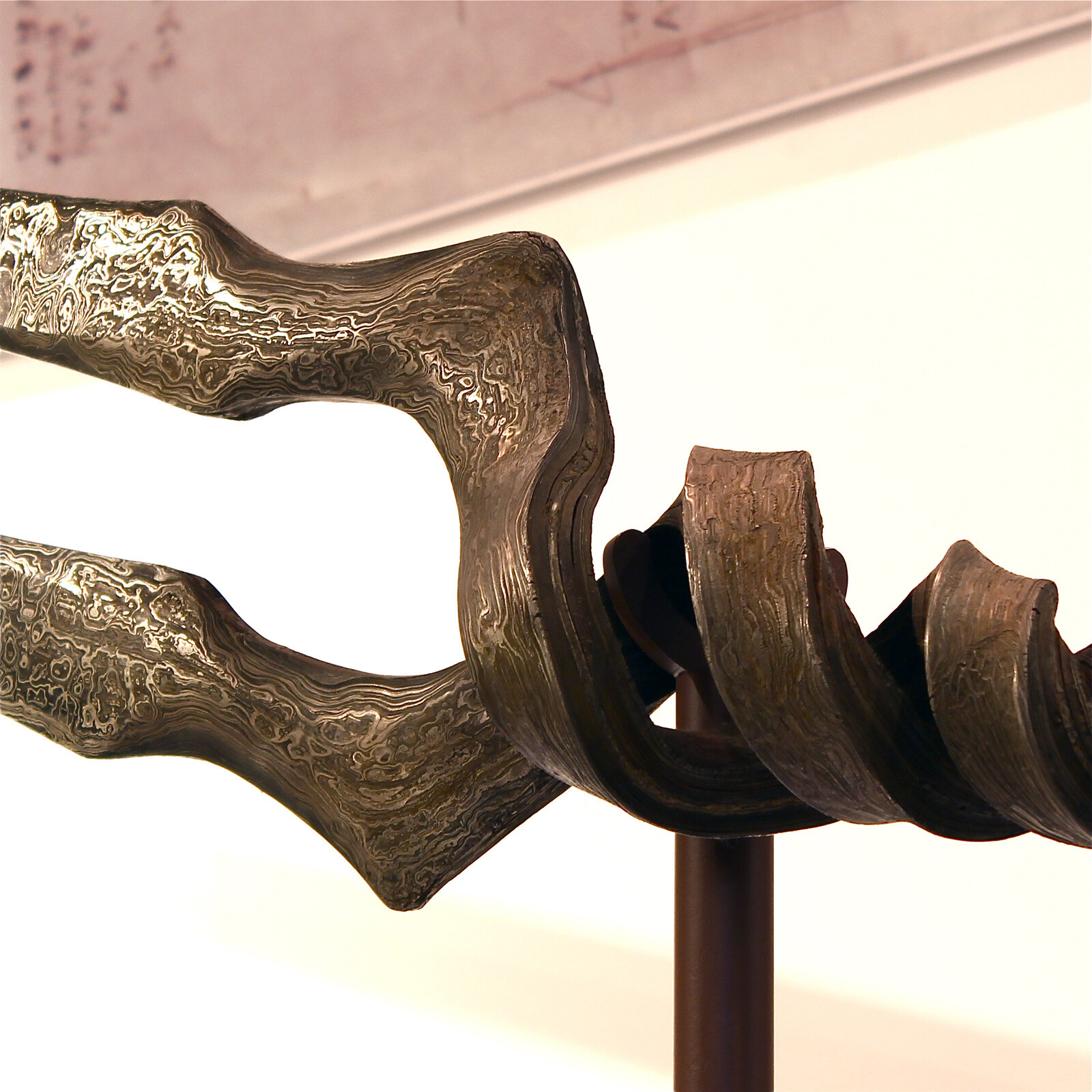 Double helix shape with Damascus finish. 4