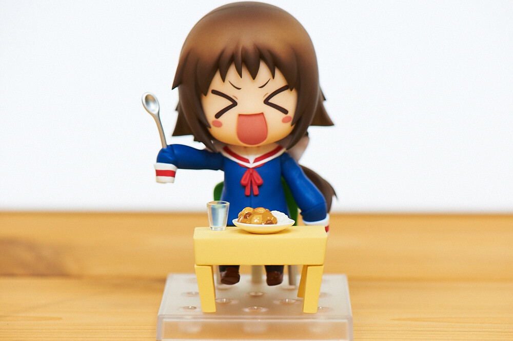 Lots of accessories! You can probably use her accessories such as the bowl of curry, the cup, the table, and the chair with other Nendoroids. 32