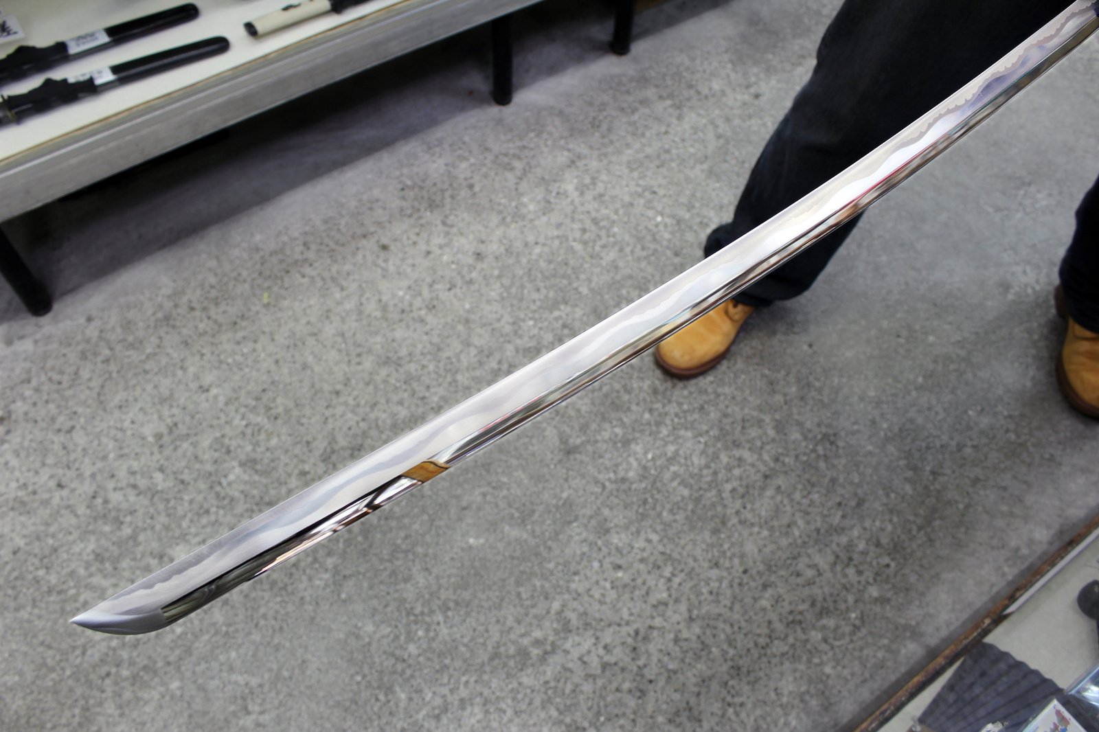 We gently unsheathed the sword. Yep, it’s a reverse-blade. The temper on the blade is beautiful... 2