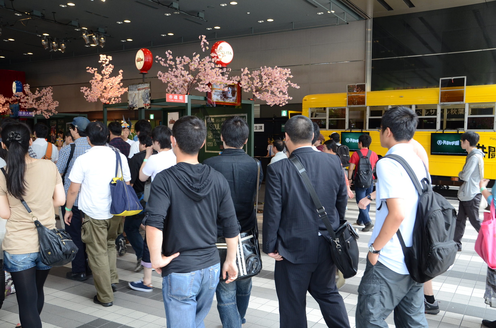 Fans surge into the hall as the event begins. 0