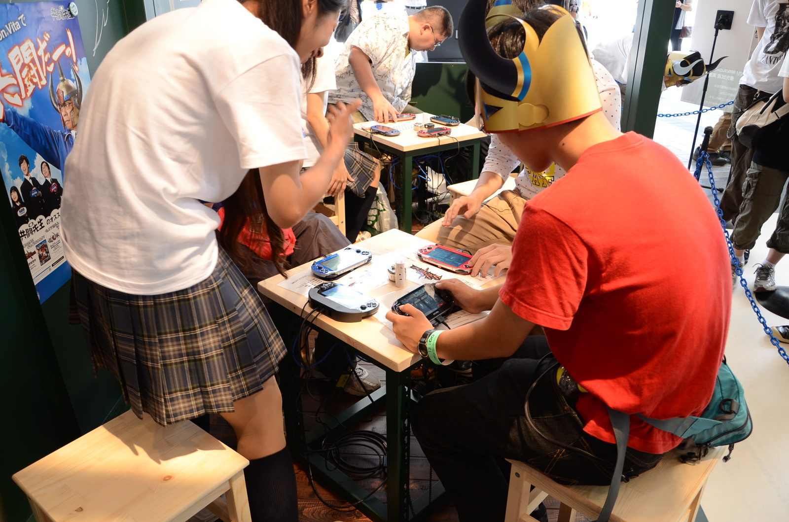 Beginners were relieved that cosplaying staff (left) were there to teach them how to play the games. 11